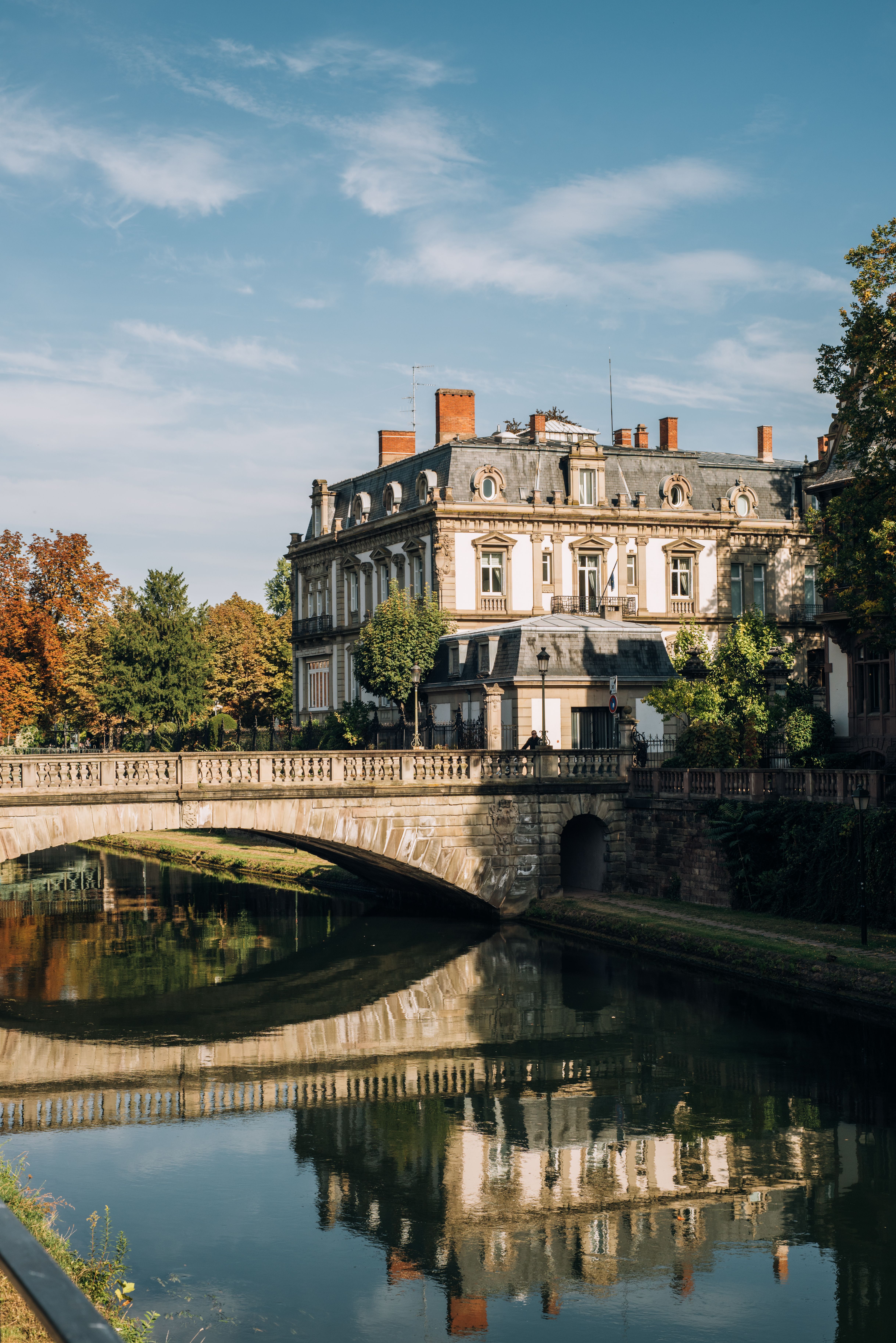 A canal-side building and bridge in Strasbourg, France