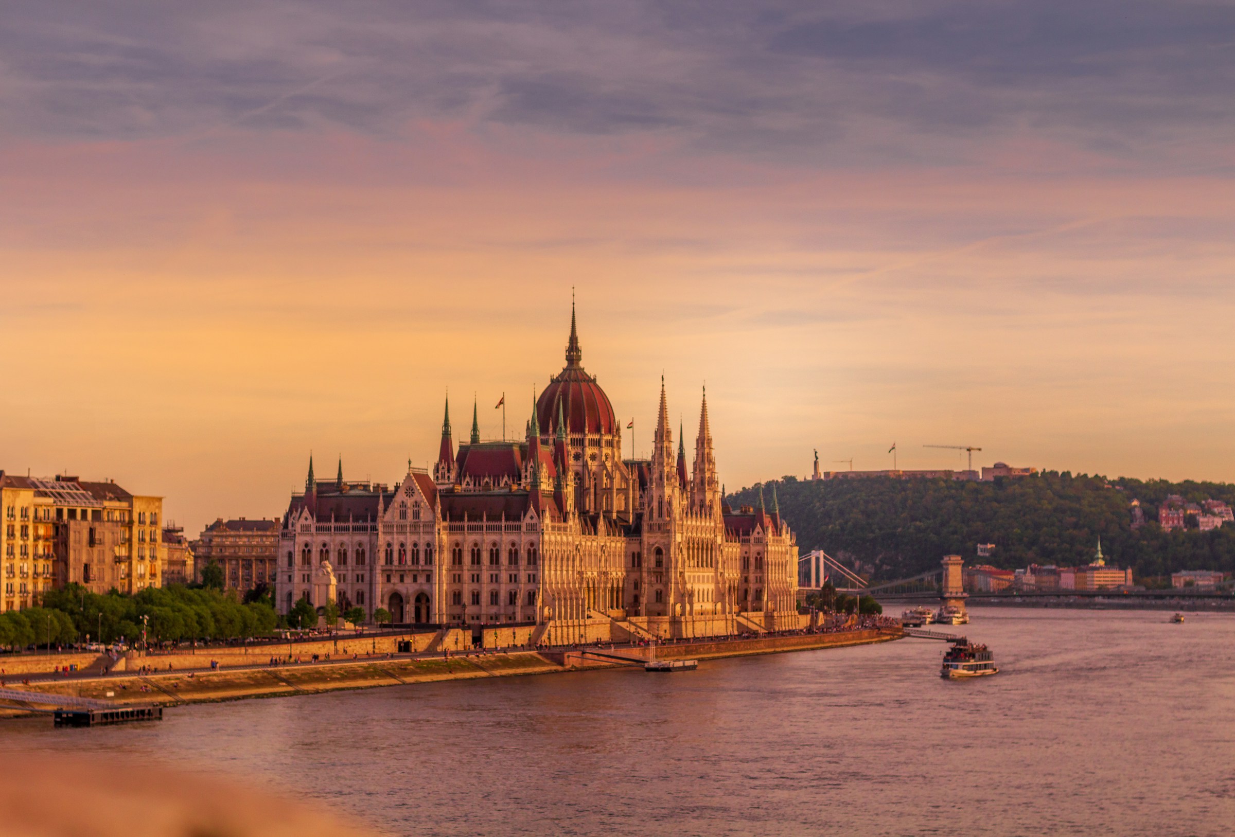 The Hungarian Parliament Building at sunrise reflected in the Danube River, Budapest